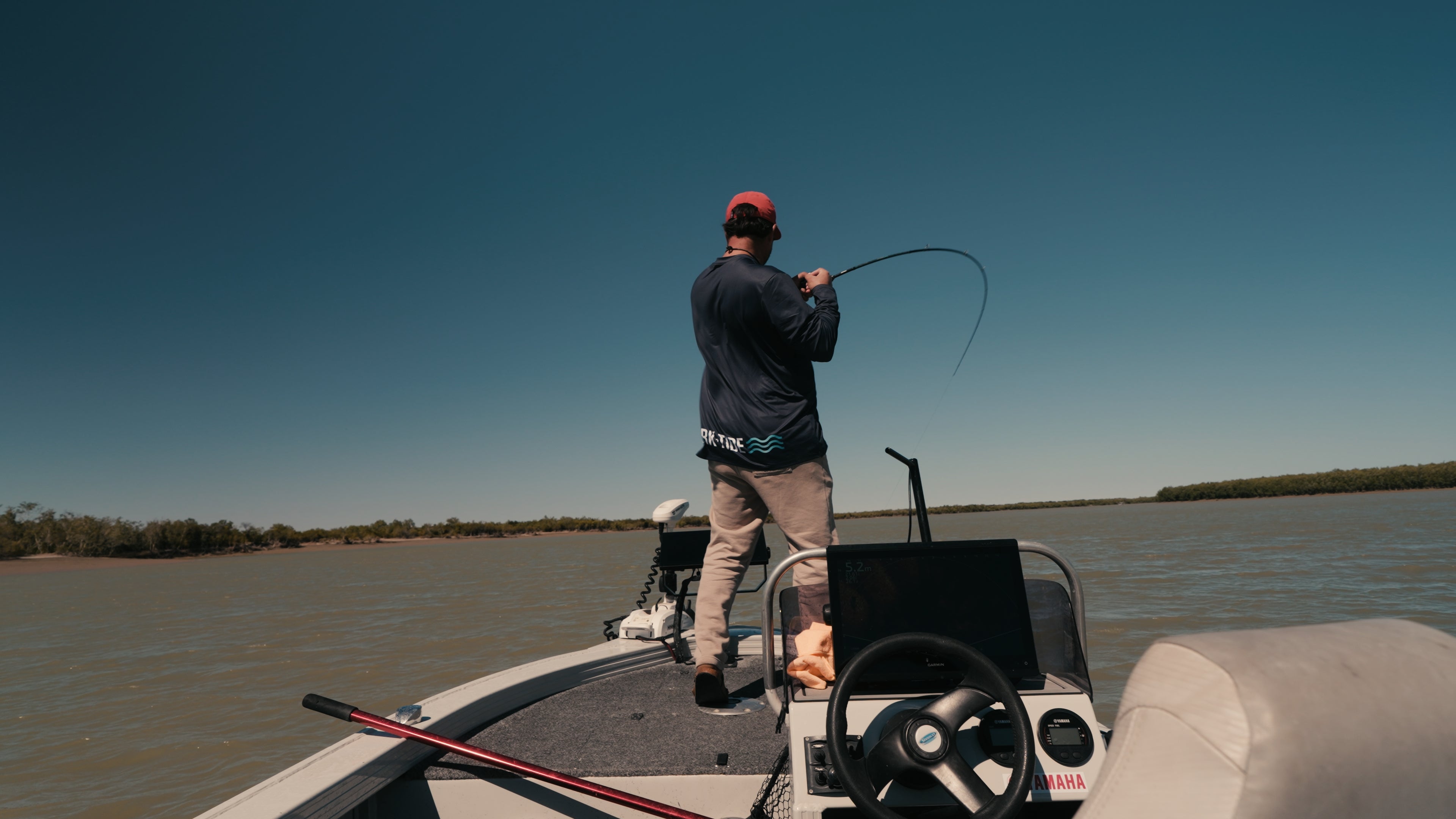Pelagic pursuit Matty fishing in North Queensland in the navy dark tide marine fishing shirt